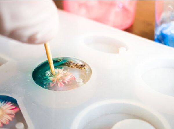 pouring resin into the jewelry mold